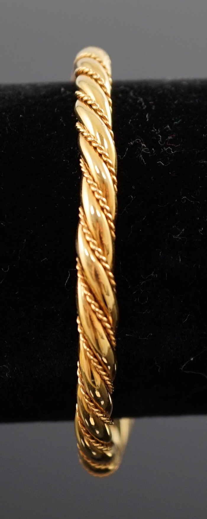 A modern Italian 18k gold open work bangle